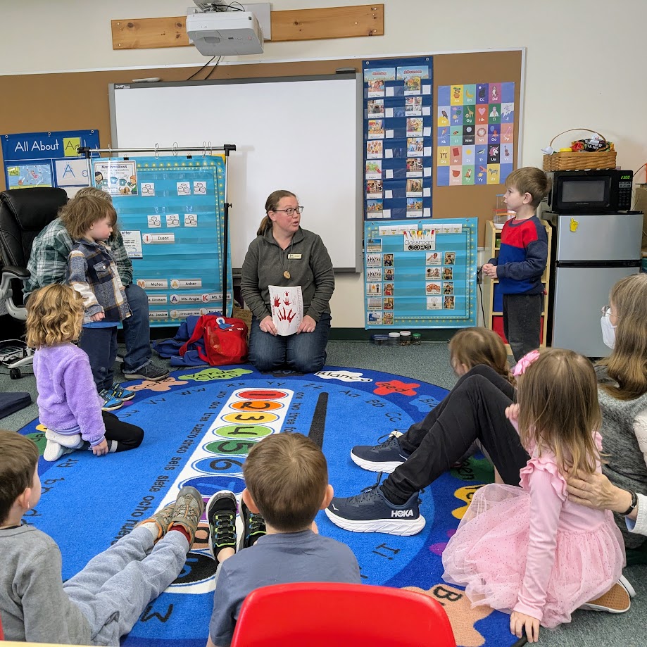 teacher showing track pictures